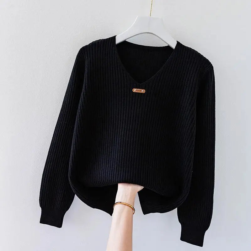 Brienna Honeyline slim-fit ribbed knit pullover top with V-neckline and metal collar accent