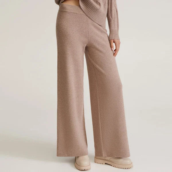 Ivory cashmere cable-knit turtleneck set with relaxed draped fit and textured knit details