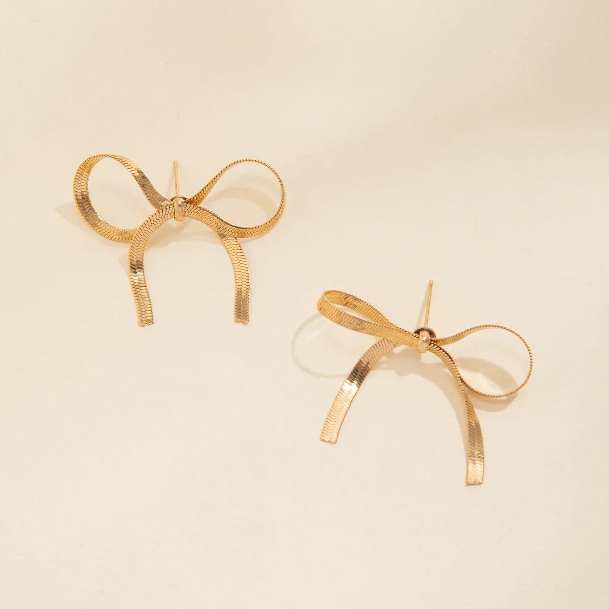 Gold silver angel bow earrings with ribbed tassels, everyday bowtie charm jewelry piece