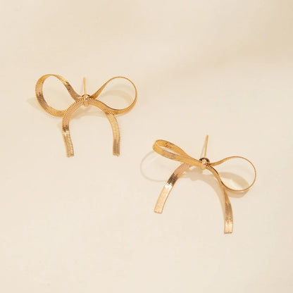 Gold silver angel bow earrings with ribbed tassels, everyday bowtie charm jewelry piece