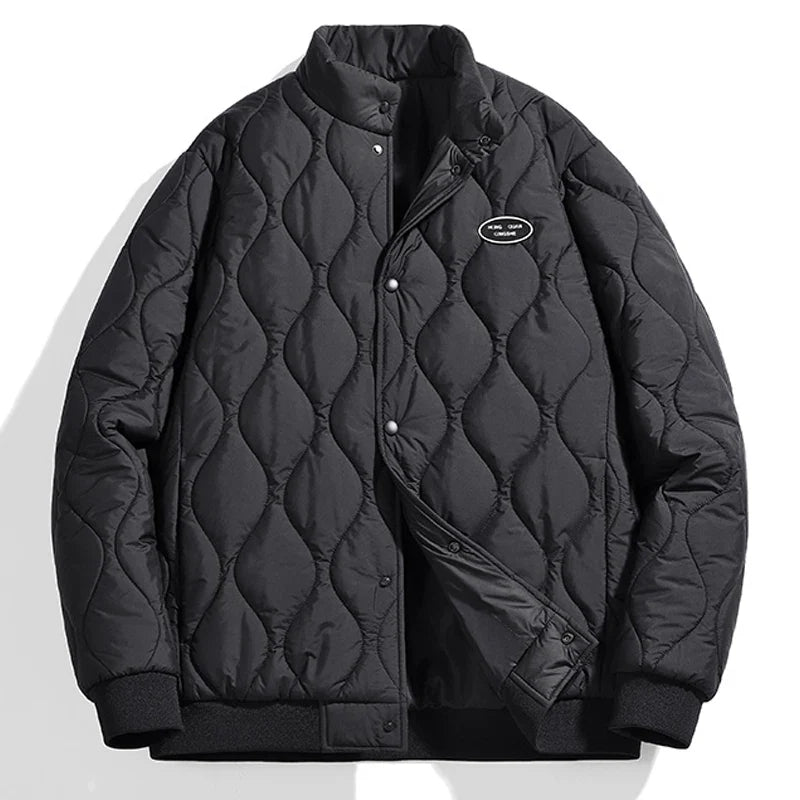 Black quilted puffer winter jacket with stand-up collar, ribbed cuffs, and snap button closure