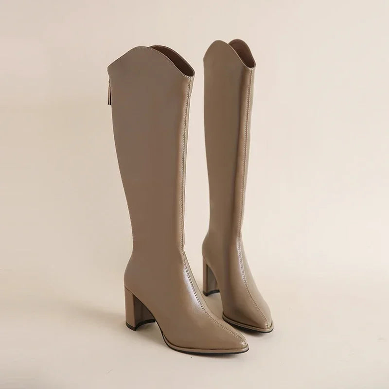 Natalia black faux leather knee-high boot with sleek silhouette and city-chic polish