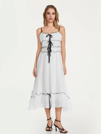 Clementine white mini dress with lace-up bodice, frill trim, and flowy feminine silhouette