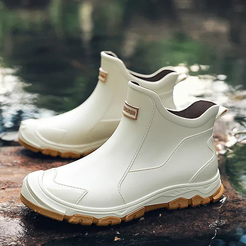 Verna Canyon knee-high rain boots in neutral tan, sleek waterproof silhouette with leg-lengthening design