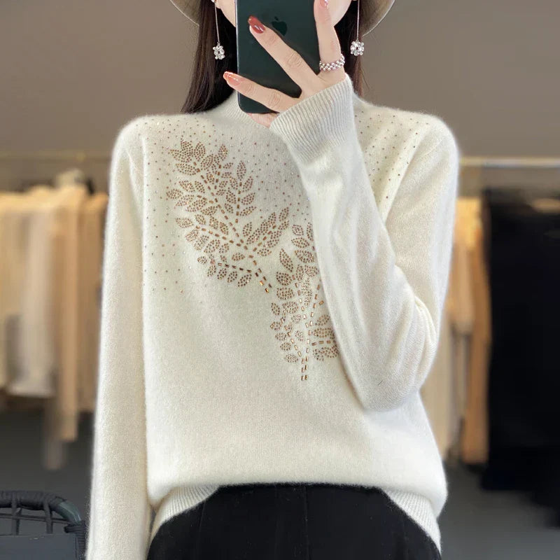 Ivory embellished sweater with delicate details, flattering silhouette, and understated glamour for chic everyday wear