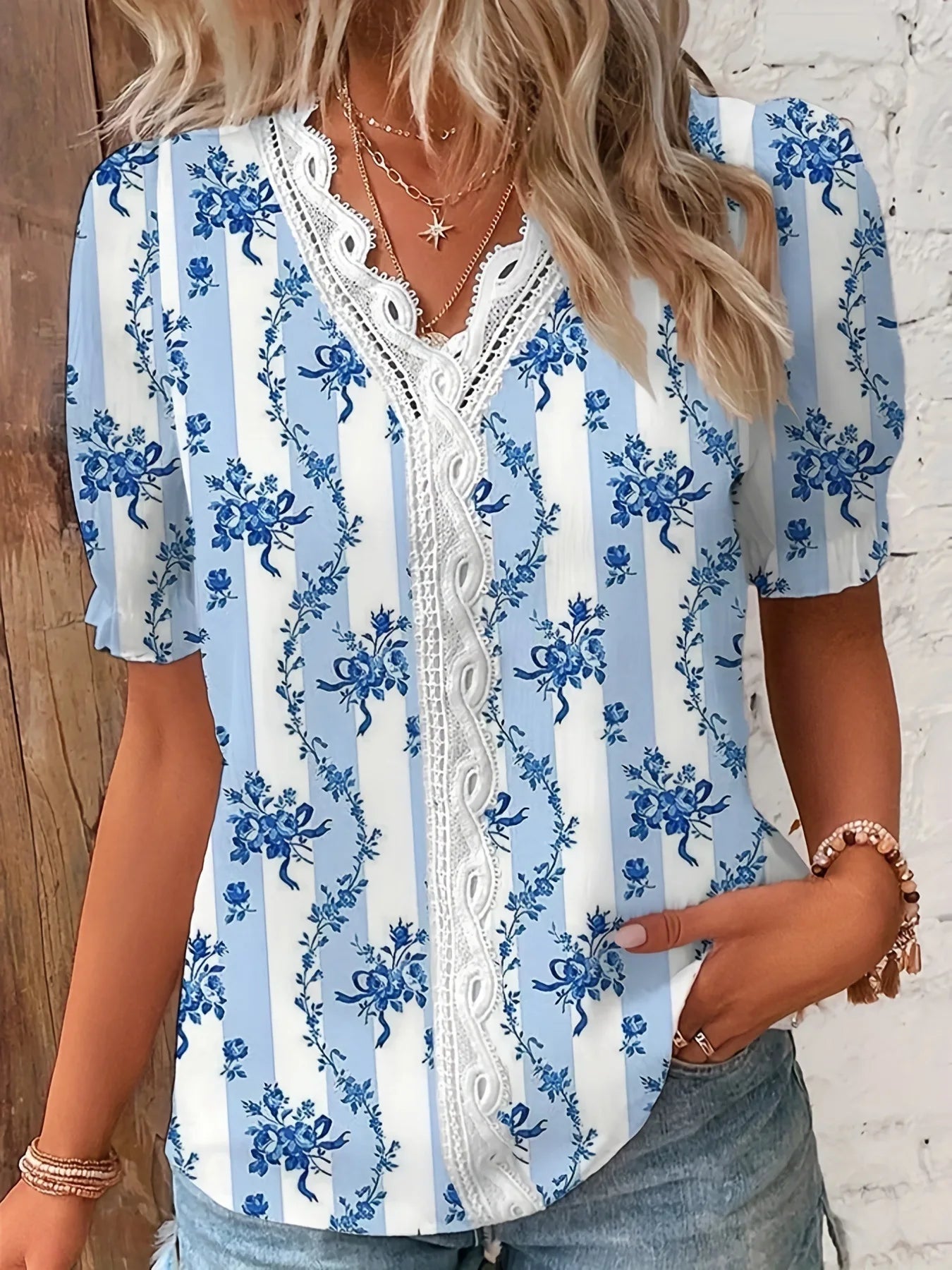 Floral lace V-neck blouse relaxed fit with delicate feminine detailing in soft neutral tones