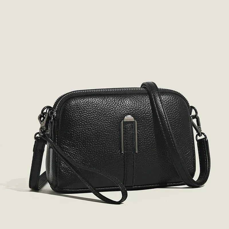 Elegant minimalist shoulder bag for women, compact design with refined silhouette and versatile styling