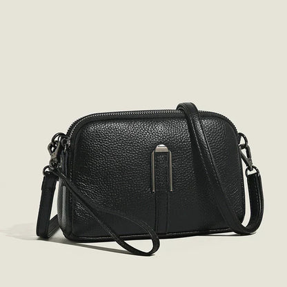 Elegant minimalist shoulder bag for women, compact design with refined silhouette and versatile styling