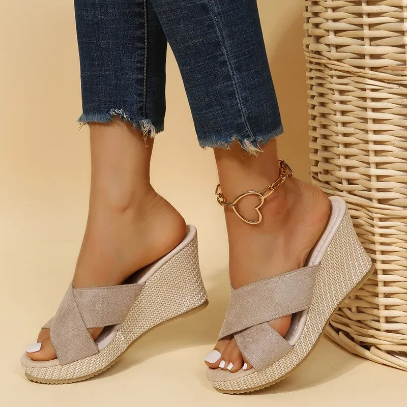 Women's beige wedge sandals with elegant strap detailing, refined silhouette for effortless summer style