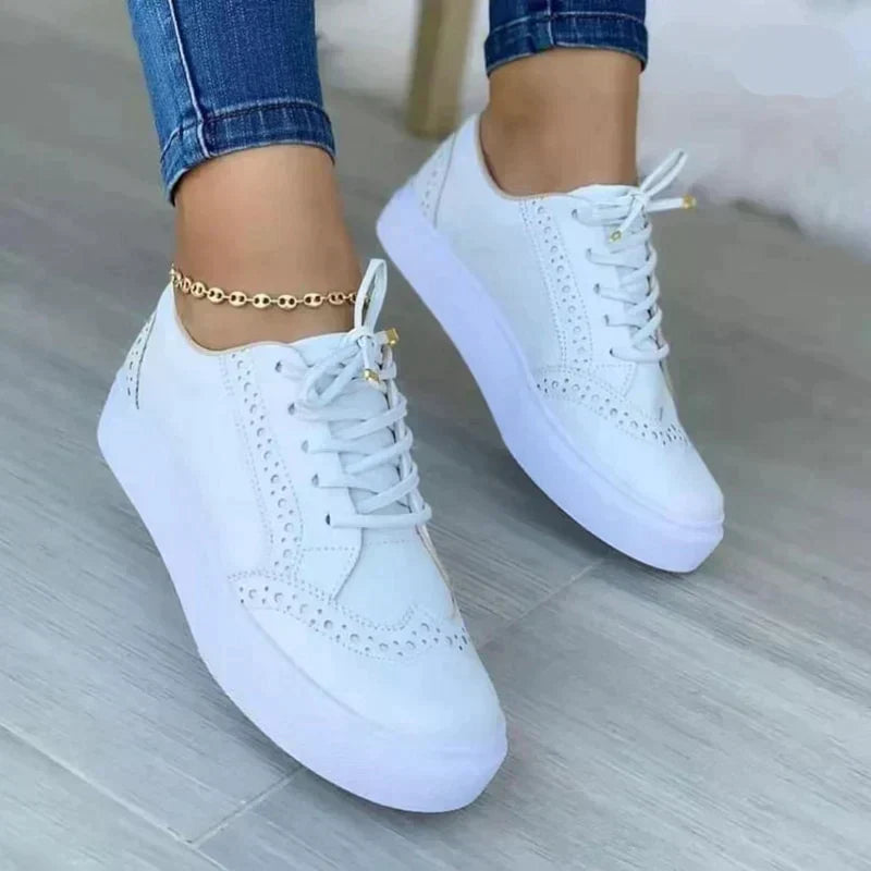 Tan suede-look women's platform sneakers with lace-up closure and brogue punch-out detailing