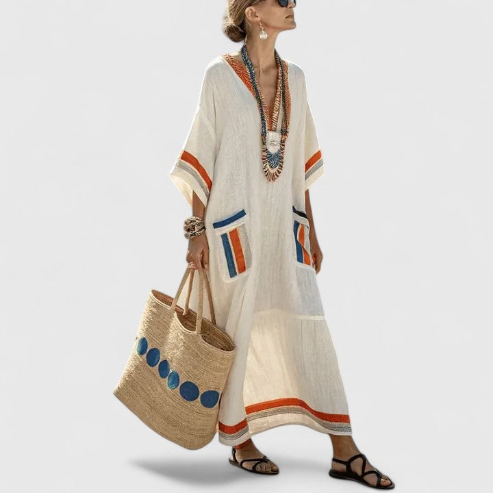 Women's mint striped linen maxi dress with V-neck, teal embroidered trim, and side pockets