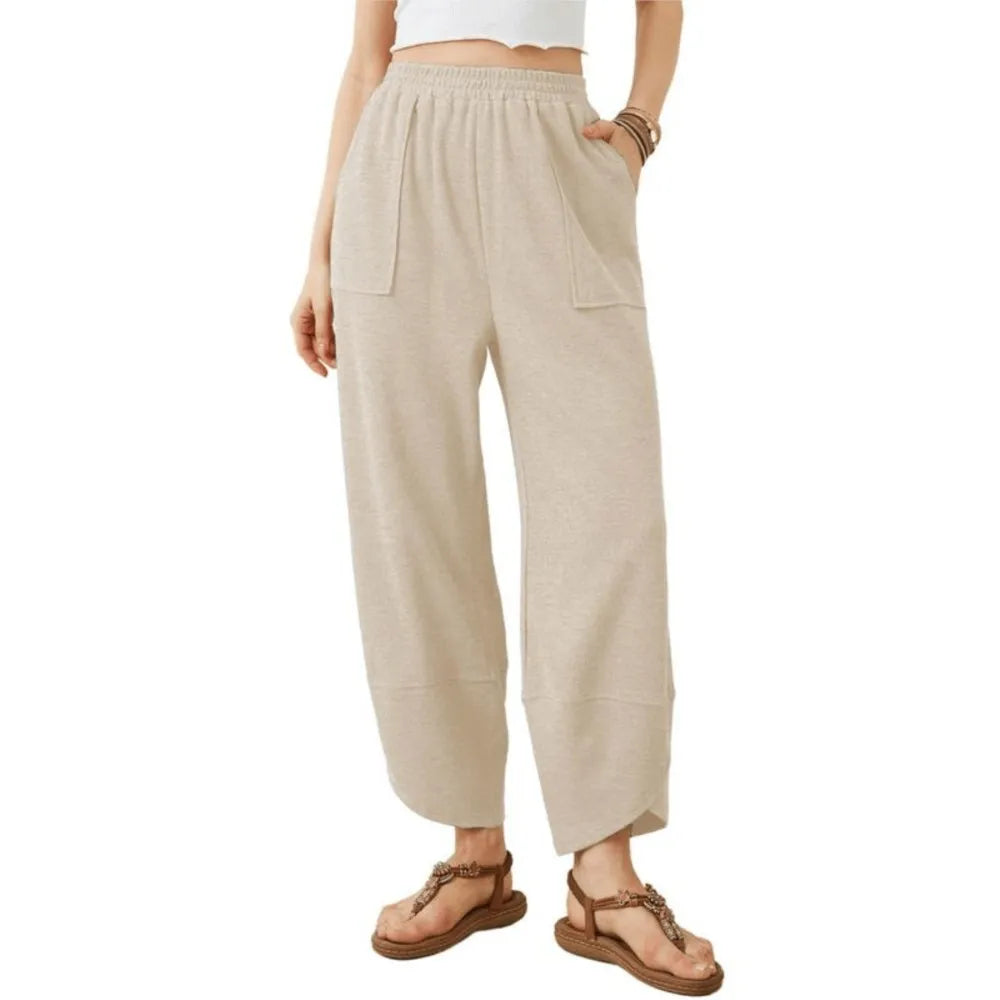 Sophia wide-leg trousers in neutral tone, relaxed fit with elastic waistband for effortless spring style