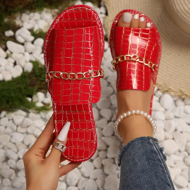 Women's croc-embossed sandals in neutral tone, sleek silhouette with quiet luxury texture