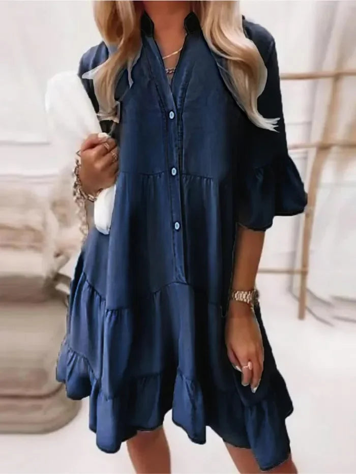 Soft blue chambray tiered ruffle mini dress with flared sleeves and button-down front