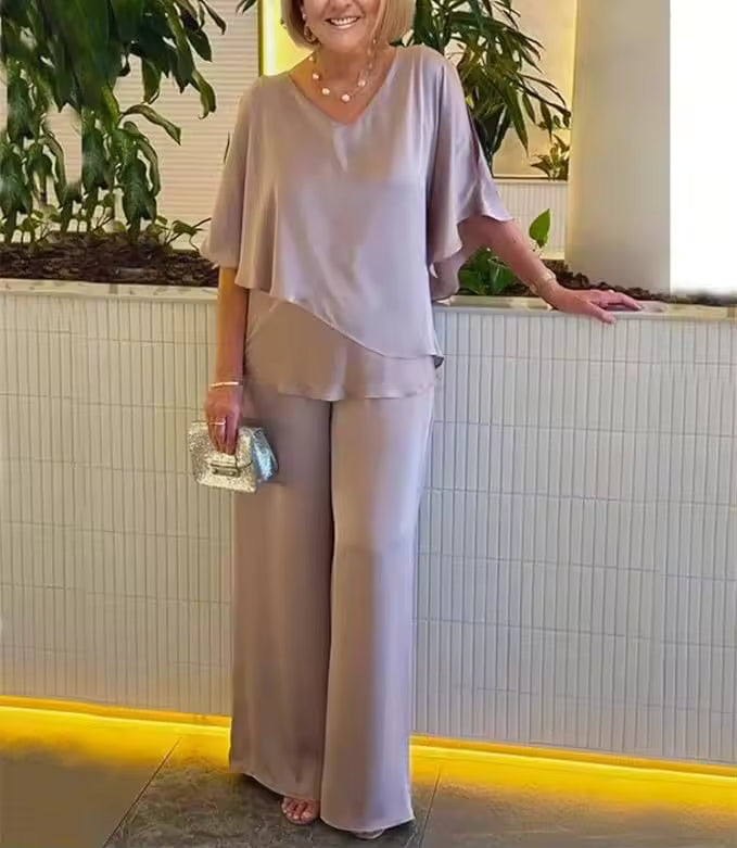 Elegant two-piece flowing top and pants set in a coordinated style with airy, polished flair