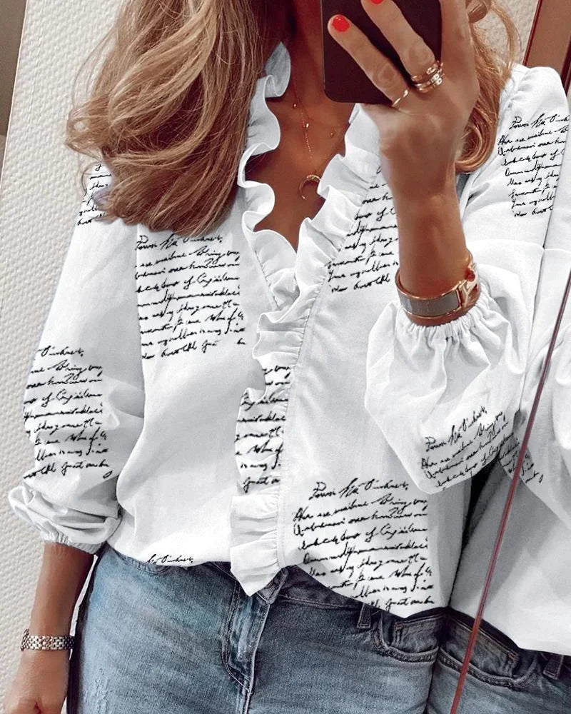 Feminine white blouse with ruffled neckline and pleated balloon sleeves for an elegant romantic look