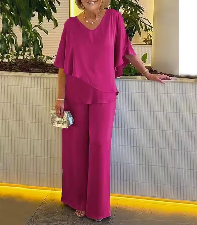 Elegant two-piece flowy top and pants set in matching tones with relaxed chic silhouette