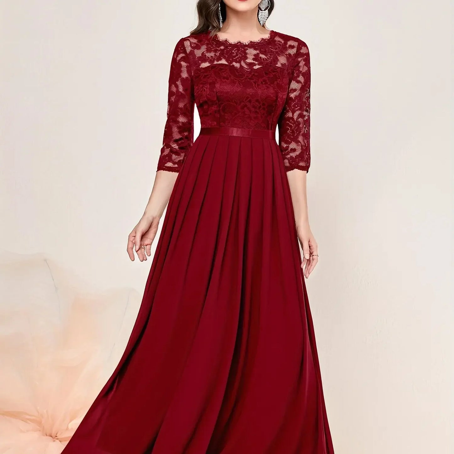 Ivory lace pleated formal evening dress with quarter sleeves and elegant floral overlay detailing