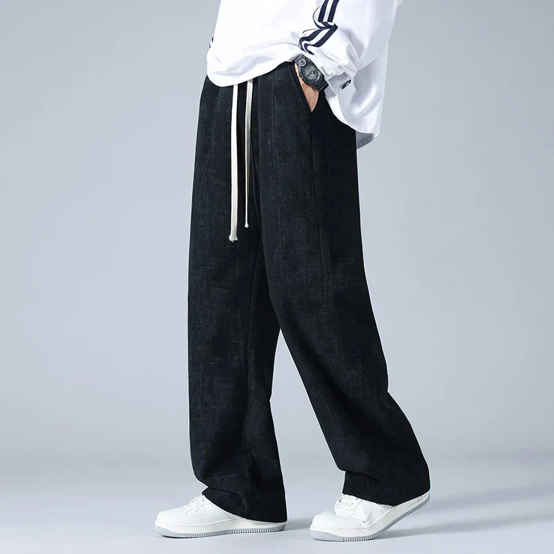 Azure blue corduroy sweatpants with relaxed wide-leg fit and utility pockets