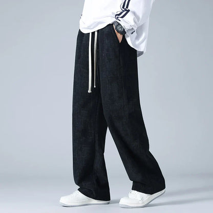 Azure blue corduroy sweatpants with relaxed wide-leg fit and utility pockets