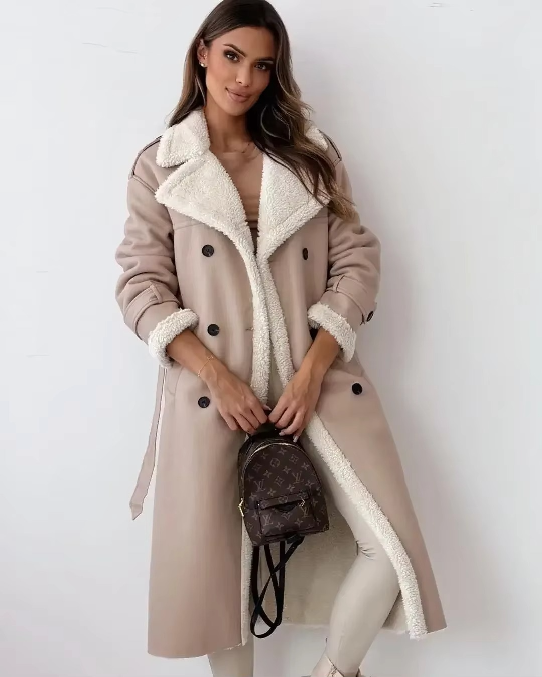 Women's black PU leather double-breasted trench coat with stand collar and warm plush lining