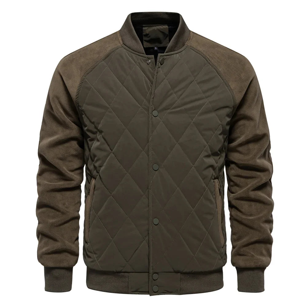 Navy quilted bomber jacket with suede-texture sleeves, diamond-quilted front, and ribbed trim