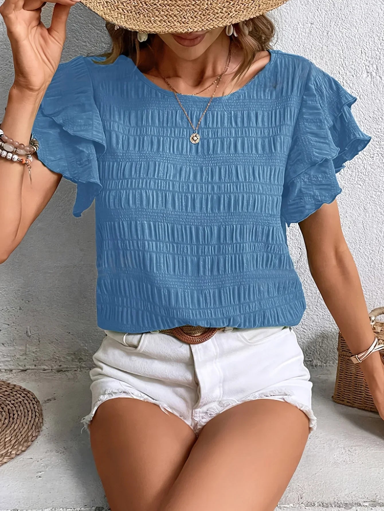 White ruffled blouse with pleated fit and delicate flutter sleeves, light breezy feminine style
