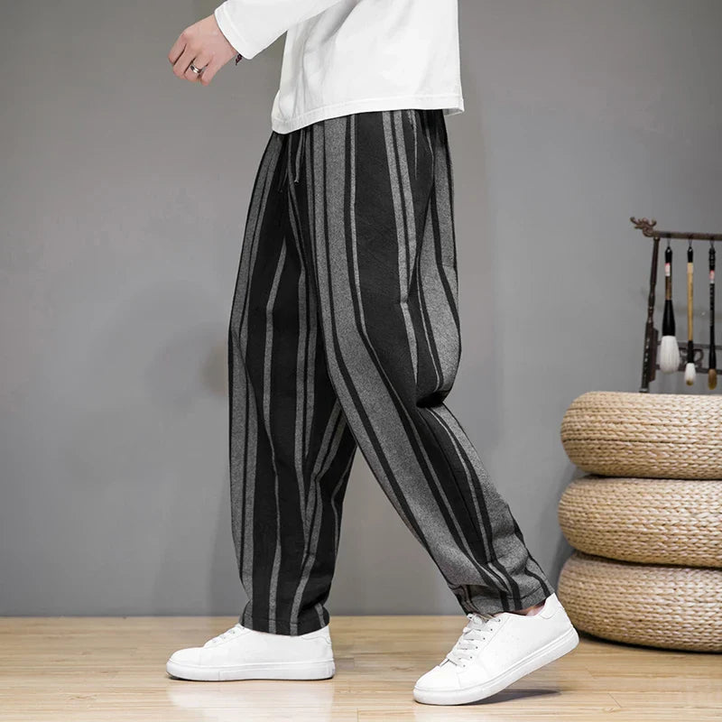 Black and white striped cropped pants in lightweight cotton-linen with a relaxed tapered ankle fit