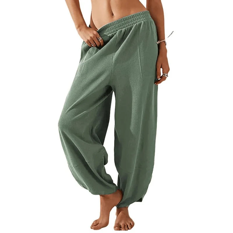Sophia wide-leg trousers in neutral tone, relaxed fit with elastic waistband for effortless spring style