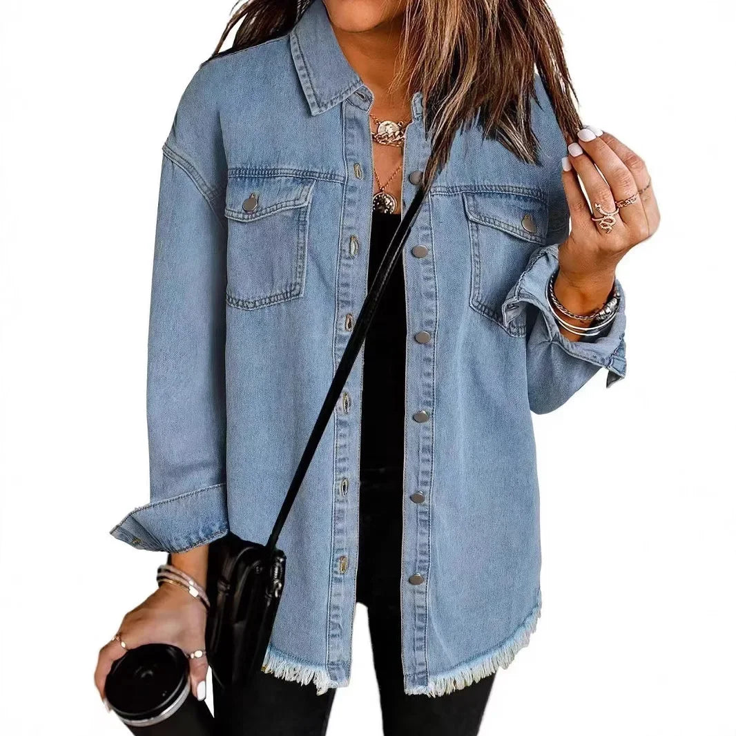 Washed denim shirt jacket with relaxed fit and raw fringe hem for effortless casual layering