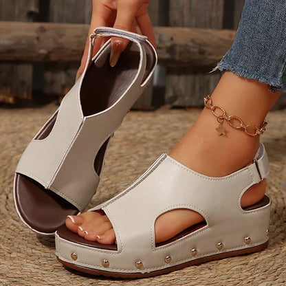 Women's platform cushioned sandals in neutral tones with elevated sole and padded footbed