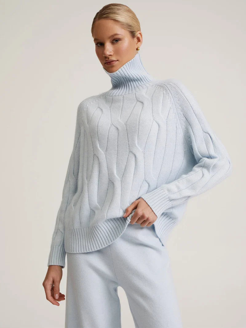 Ivory cable-knit cashmere turtleneck set with relaxed fit and textured knit details