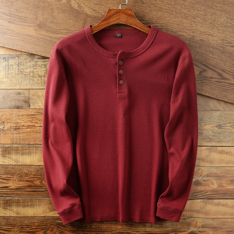 Cream waffle knit Henley long sleeve shirt with minimalist design and double-stitched collar