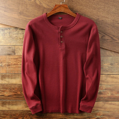 Cream waffle knit Henley long sleeve shirt with minimalist design and double-stitched collar