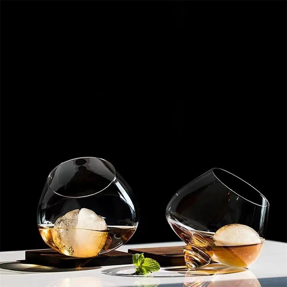 Dane whiskey glass with rotating base design for an engaging and stylish drinking experience