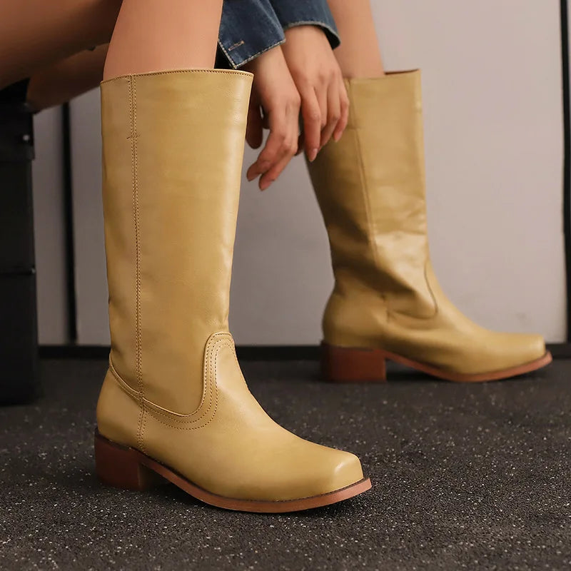 Black ankle-height comfort boots with sleek smooth contours and supportive cushioned sole