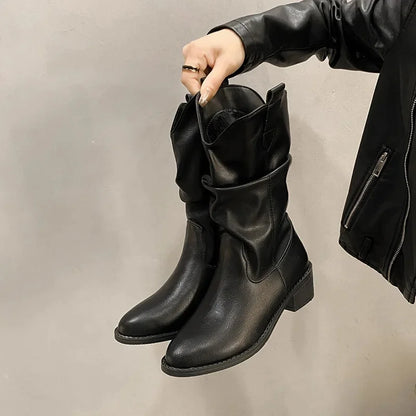 Women's brown leather knee-high slouch boots with low heel, relaxed shaft silhouette