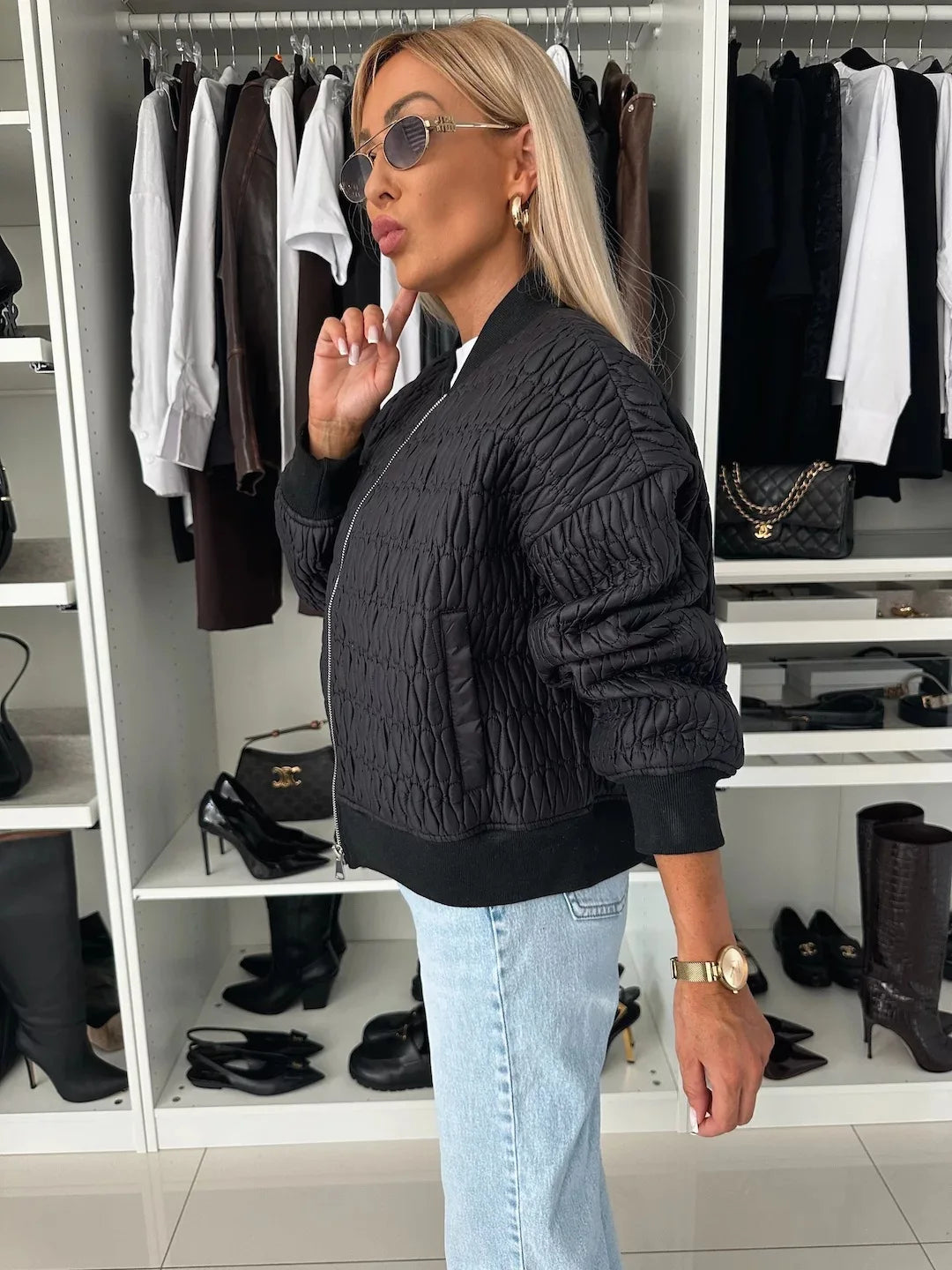 Women's quilted bomber jacket in sleek modern silhouette with textured pattern for sporty-elegant style
