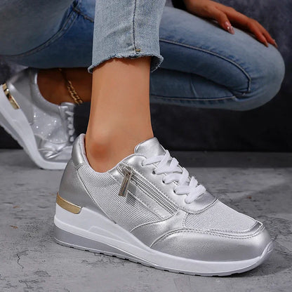 Women's silver metallic platform sneakers with lunar-shine upper and bold chunky sole