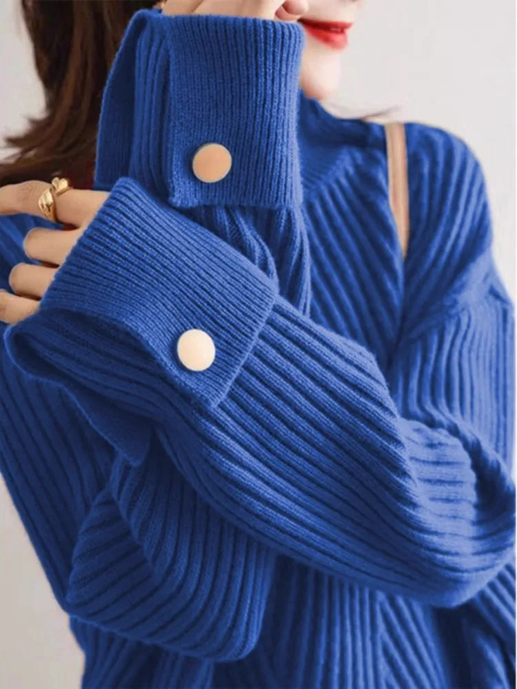 Lorie oversized ribbed knit pullover in neutral tone with high neck and contrast button cuffed detail