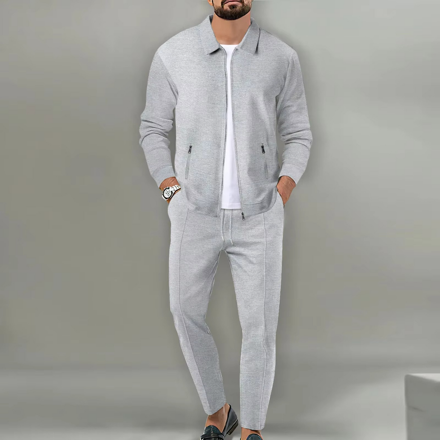 Men's two-piece polo jacket shirt and matching drawstring pants set in coordinated everyday comfort style