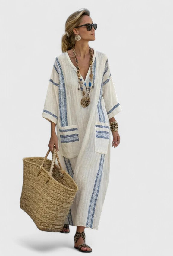 Women's blue stripe kaftan maxi dress with deep V-neckline and flowing silhouette