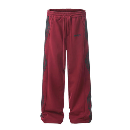 Men's loose fit black track pants with wavy side stripe and drawstring waist, cotton-poly blend