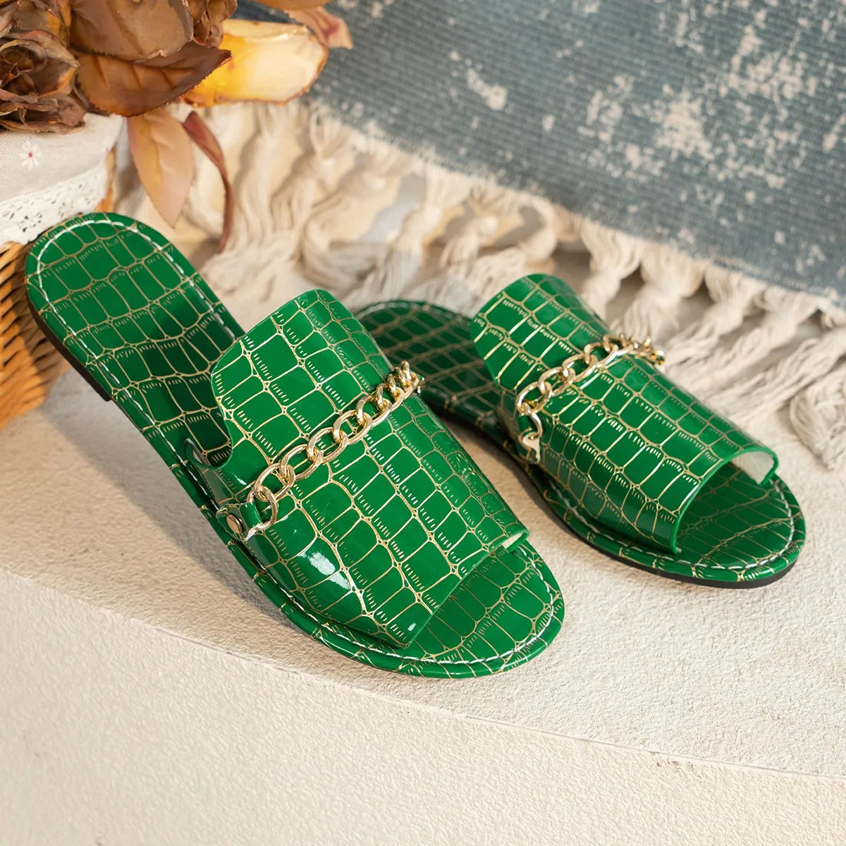 Women's croc-embossed sandals in neutral tone, sleek silhouette with quiet luxury texture