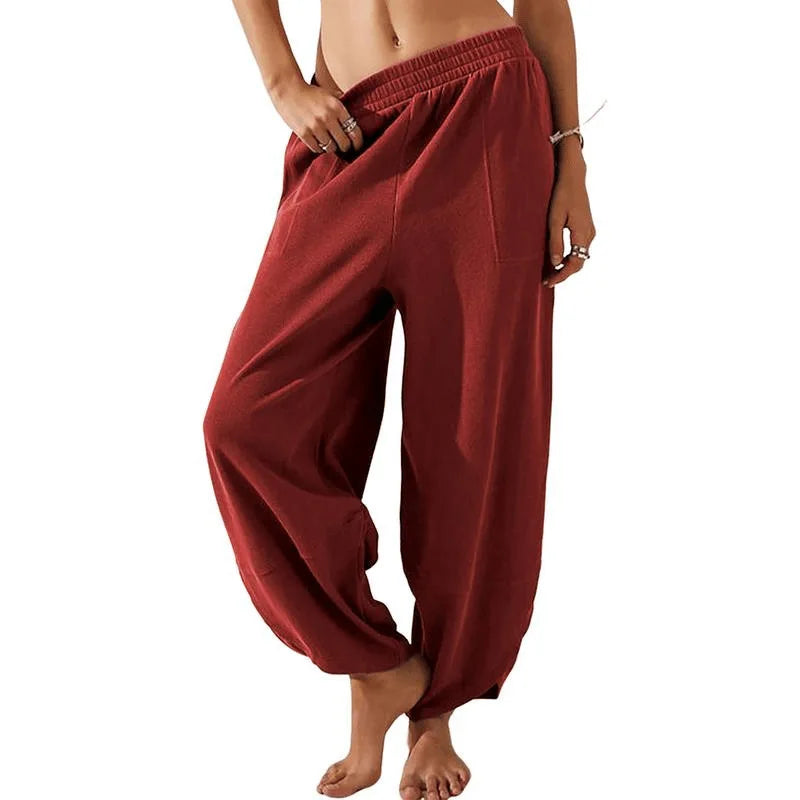 Sophia wide-leg trousers in neutral tone, relaxed fit with elastic waistband, lightweight breathable fabric