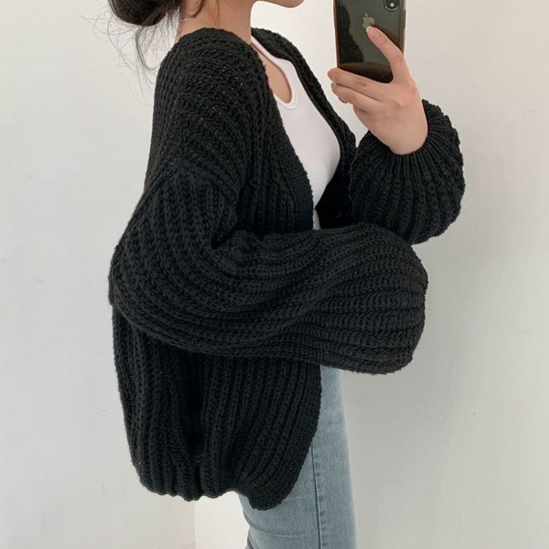 Women's oversized open front chunky ribbed knit cardigan in neutral tone with dropped shoulders