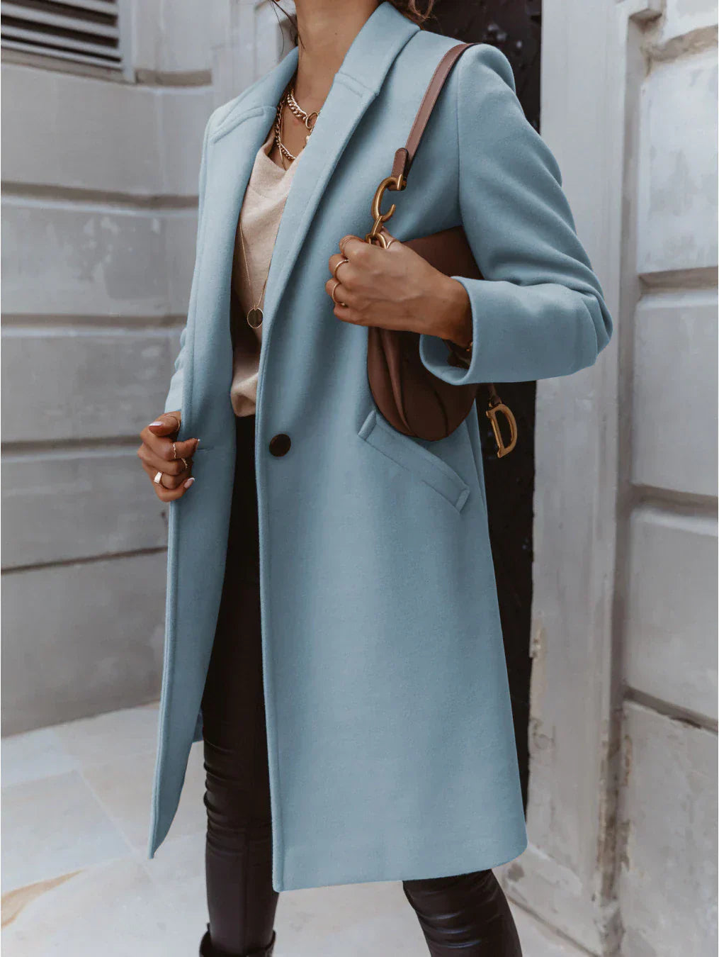 Women's double-breasted longline coat structured silhouette versatile layering essential for modern styling