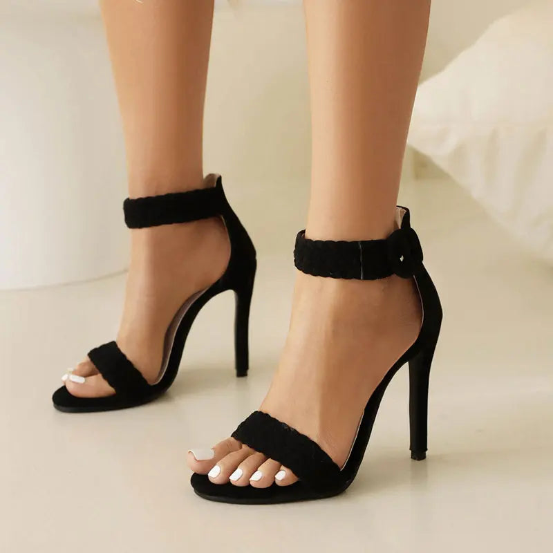 Women's flat ankle strap sandals in neutral tones with cushioned sole and elegant minimalist silhouette