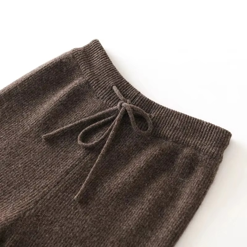 Women's high waist wide-leg woolen knit pants in neutral tones, cozy fall winter style with ribbed texture