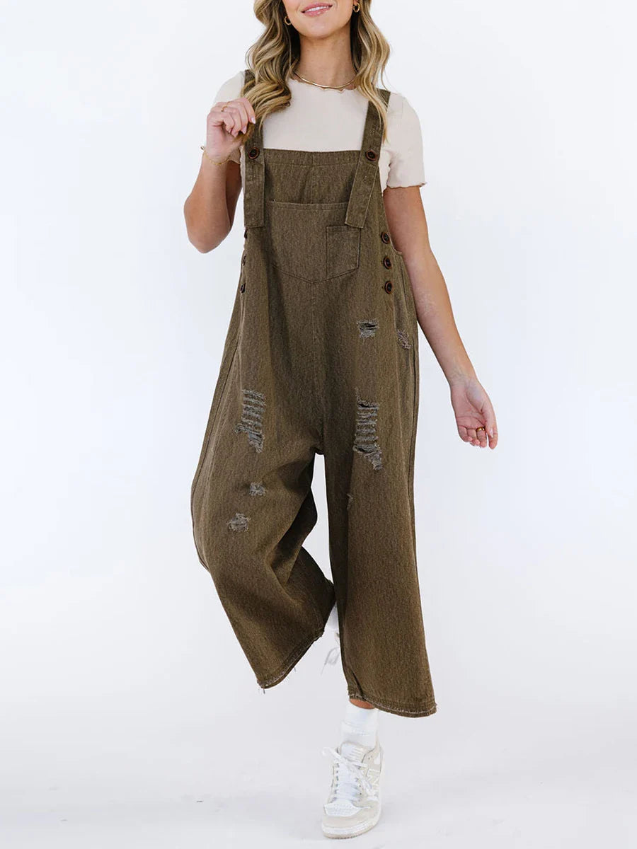 Women's washed denim wide-leg overalls with raw-edge distressing, adjustable straps, relaxed vintage fit